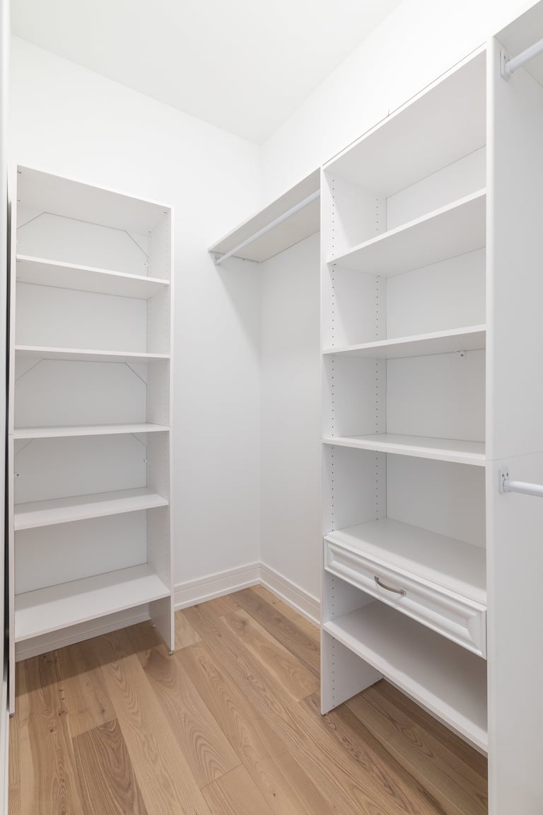Closet shelving with white walls and built-in shelves