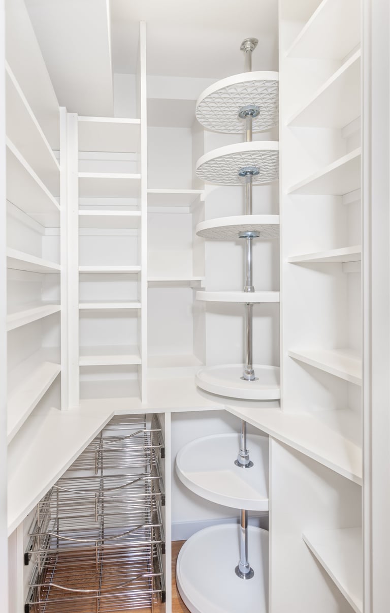 Compact walk-in kitchen pantry with shelves and baskets