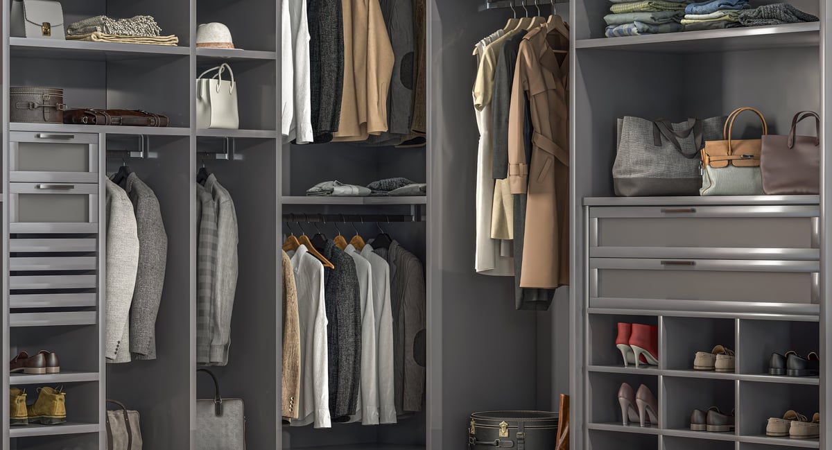 Large, gray, well-organized walk-in closet